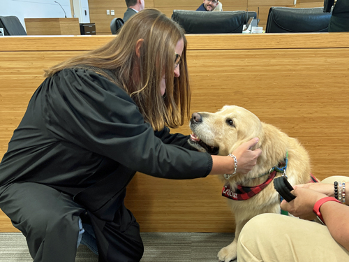 Judge Dees with therapy dog Cracker