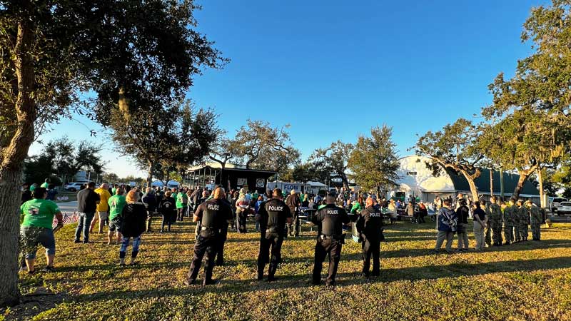This is an image of a group of people standing around a stage.